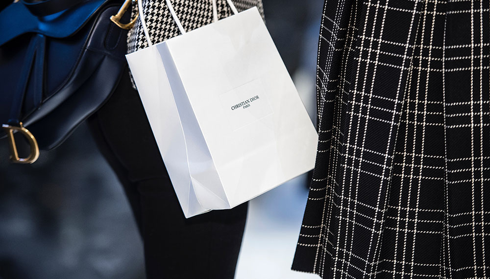 two women carrying shopping bags